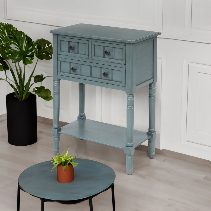 Optimisez votre espace avec la table console TREXM ! Avec son design élégant en bleu marine et ses 3 tiroirs de rangement, elle s'adapte parfaitement aux petits salons."